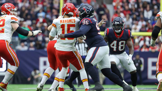 Dec 18, 2022; Houston, Texas, USA; Houston Texans defensive tackle Maliek Collins (96) tackles Kansas City Chiefs quarterback Patrick Mahomes (15) on a play during the second quarter at NRG Stadium. Mandatory Credit: Troy Taormina-USA TODAY Sports  